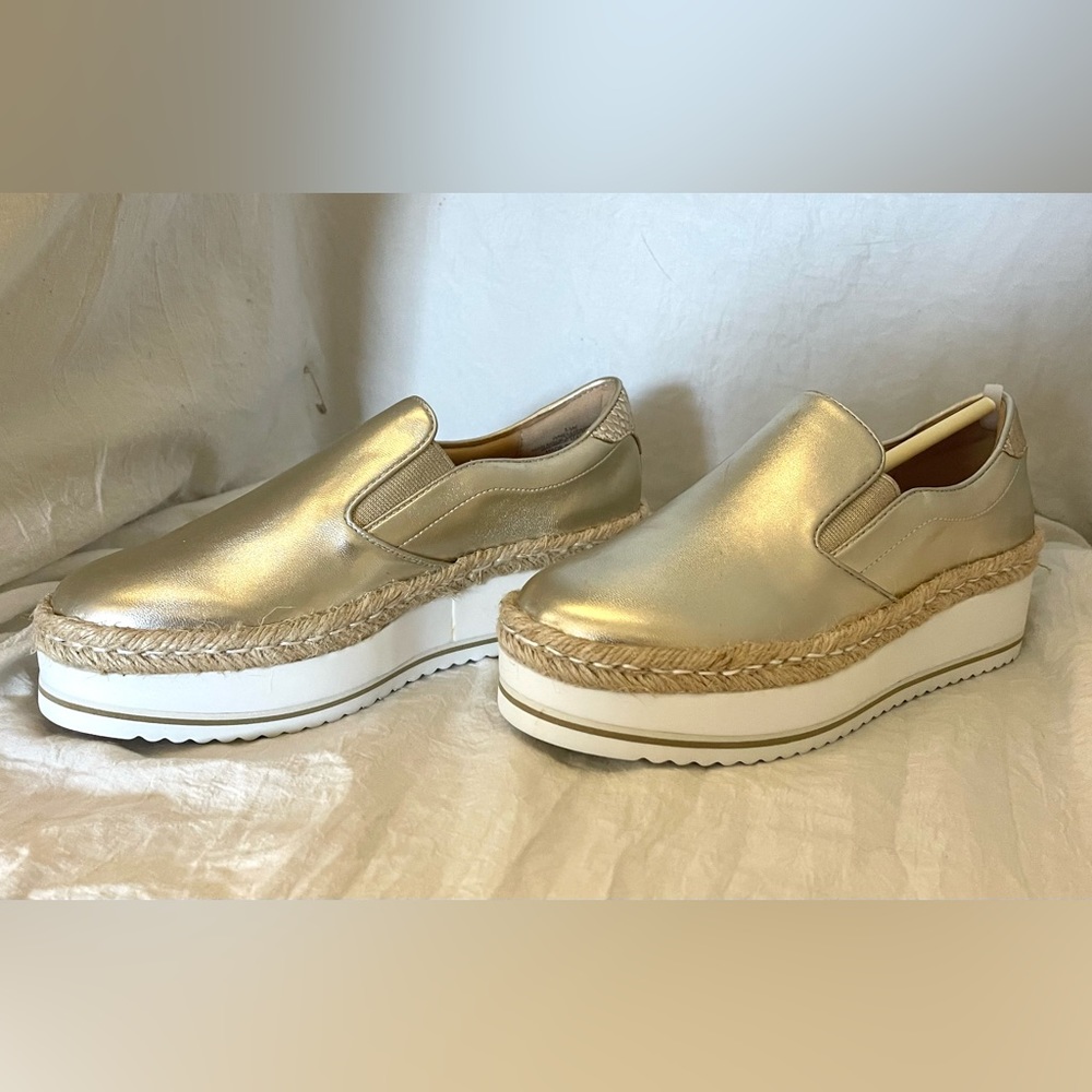 NEW!!! Never worn, original box . Metallic Gold Sneakers, super comfortable.